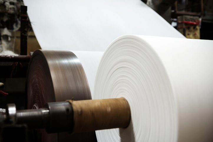Paper rolls moving through a production line